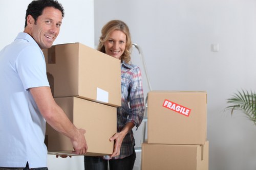 Professional movers assisting with loading items into a van